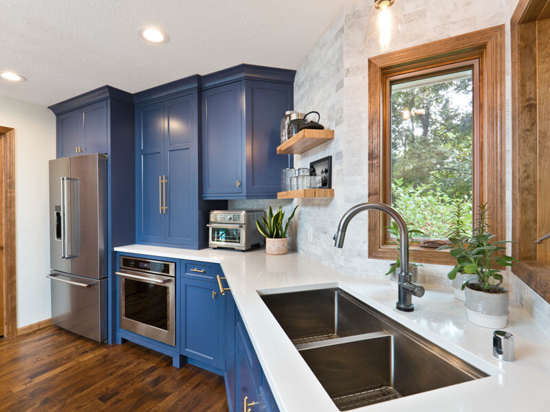 blue cabinets with white counter tops