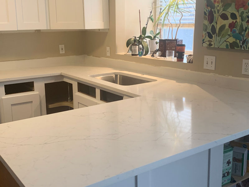 White kitchen countertops and island during countertop remodeling project