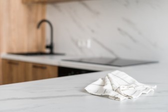 Quartzite countertop cleaning cloth on kitchen surface